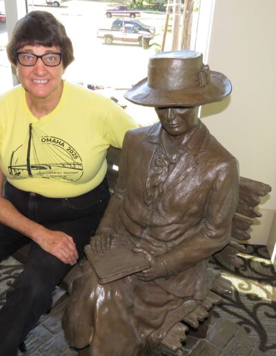 Barb Batie with Willa Catcher sculpture